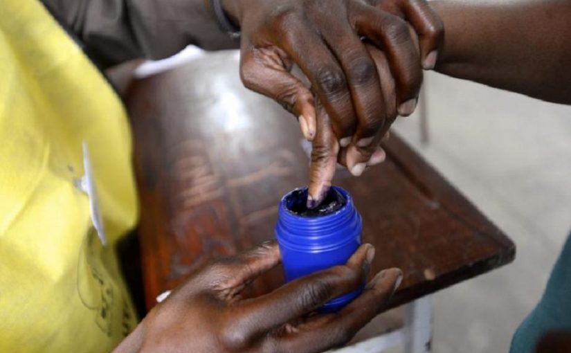 A voter's finger is marked after voting in the general election in Maputo October 15, 2014. REUTERS/Grant Lee Neuenburg
