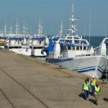 Security guards patrol past the EMATUM fishing fleet docked in Maputo, Mozambique. REUTERS/Grant Lee Neuenburg