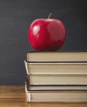 Apple and stack of books