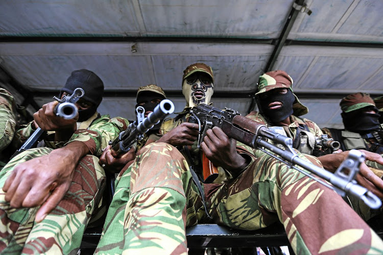 19 November 2017. Thousands of people thronged the city of Harare to participate in the historic march to State House to get rid of President Robert Gabriel Mugabe who has been in power since independence in 1980. The march was preceded by a massive rally by all citizens which have been organized by the Zimbabwe National Liberation War Veterans Association led by Comrades Chris Mutsvangwa, Victor Matemadanda and Douglas Mahiya. Outside State House, the official residence, some people staged a sit-down protest in front of a line of troops. At the same time political parties, human rights organisations and citizens yesterday hailed the  Zimbabwe Defence Force for guaranteeing safety of the people as they steeped in to restore sanity in Government. 
Picture:Moeletsi Mabe/Sunday Time